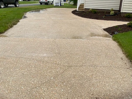Clean driveway surface maintained by Kingstone Design & Build