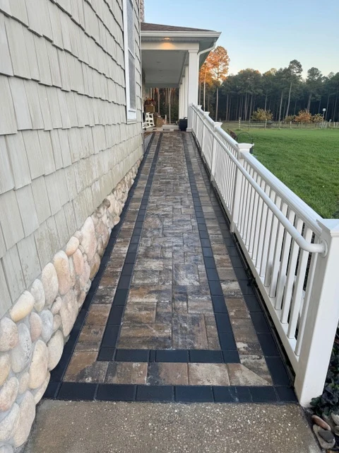 Paver walkway alongside a coastal Delaware home