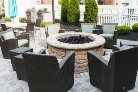 Outdoor fire pit built into a hardscape patio area