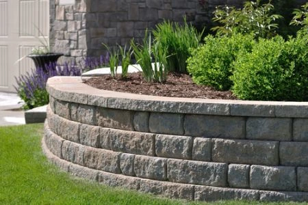 Retaining wall built into a landscaped property